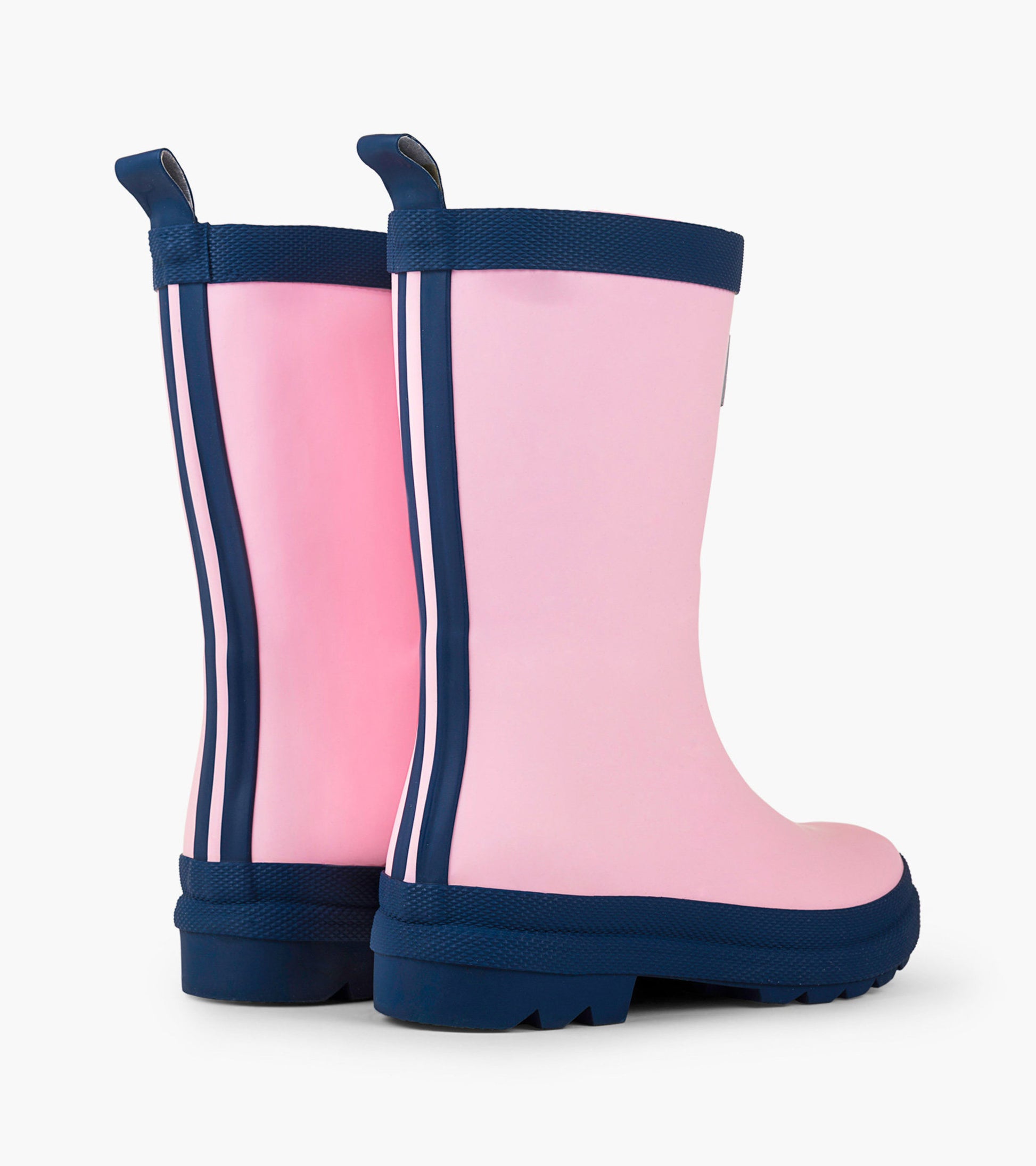 Pink and navy matte rain boots with striped detailing and textured soles, designed for kids.
