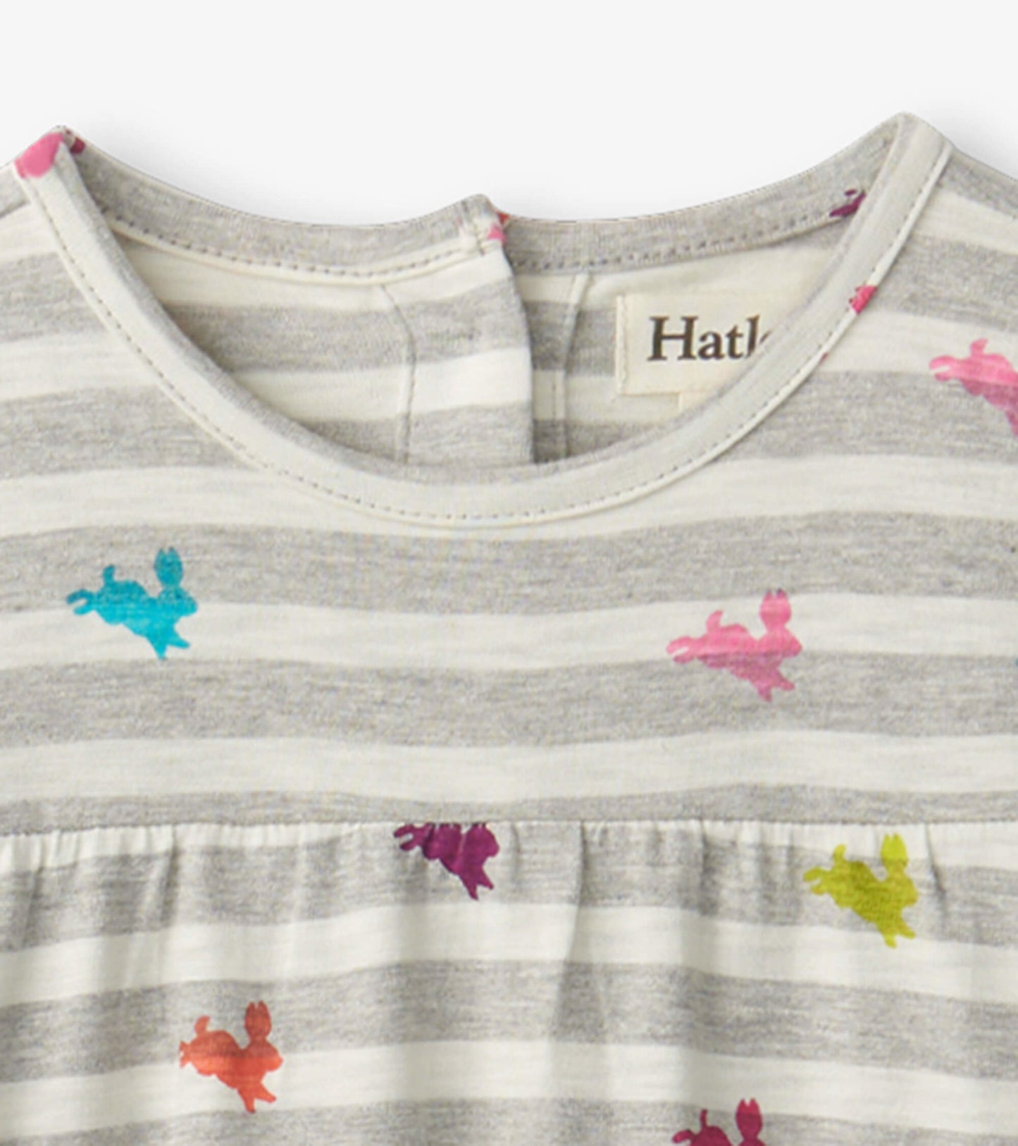 Gray and white striped tiered dress featuring colorful bunny prints in pink, blue, purple, and green.