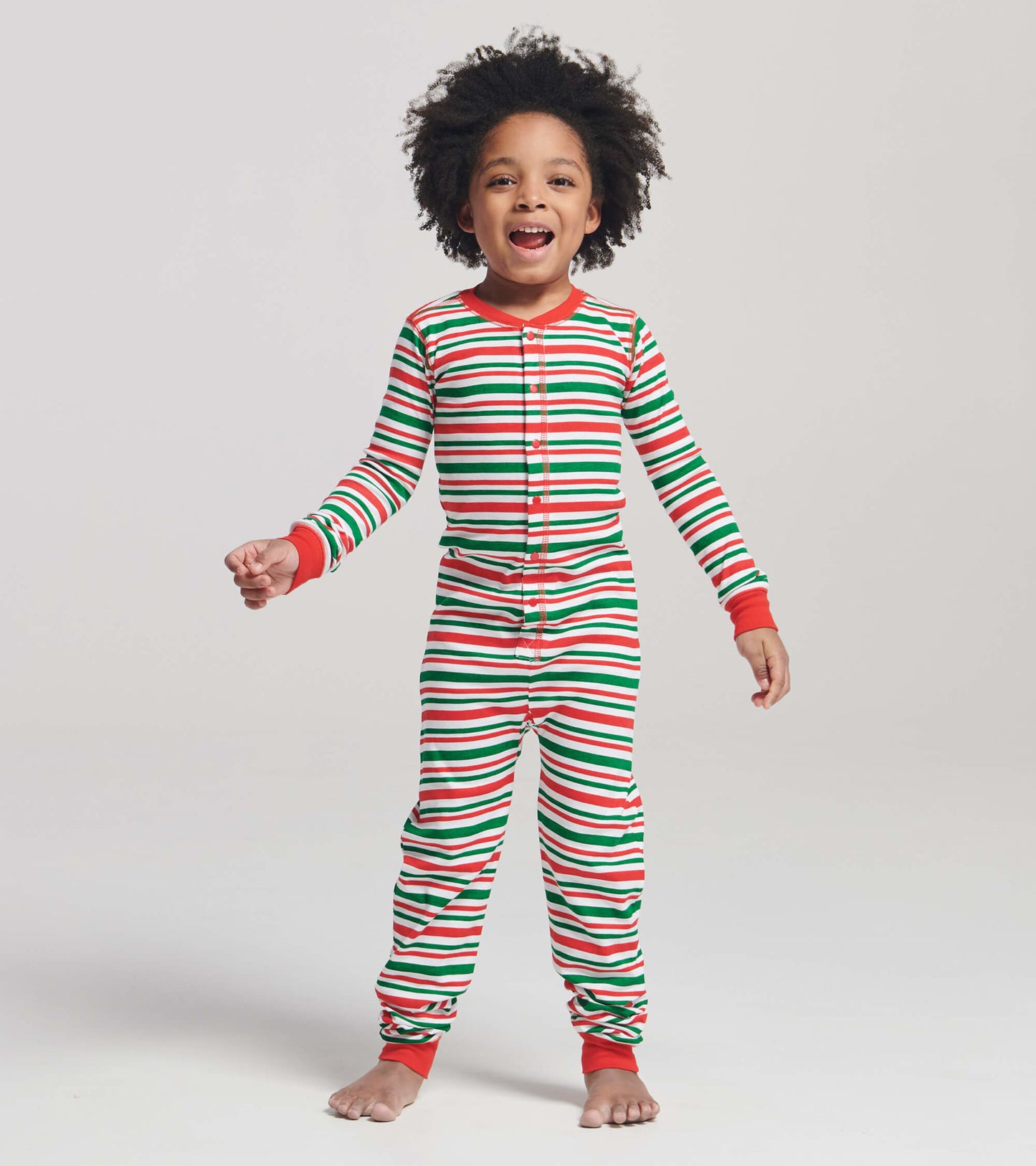 Red, green, and white striped onesie with long sleeves and buttons, designed for kids.