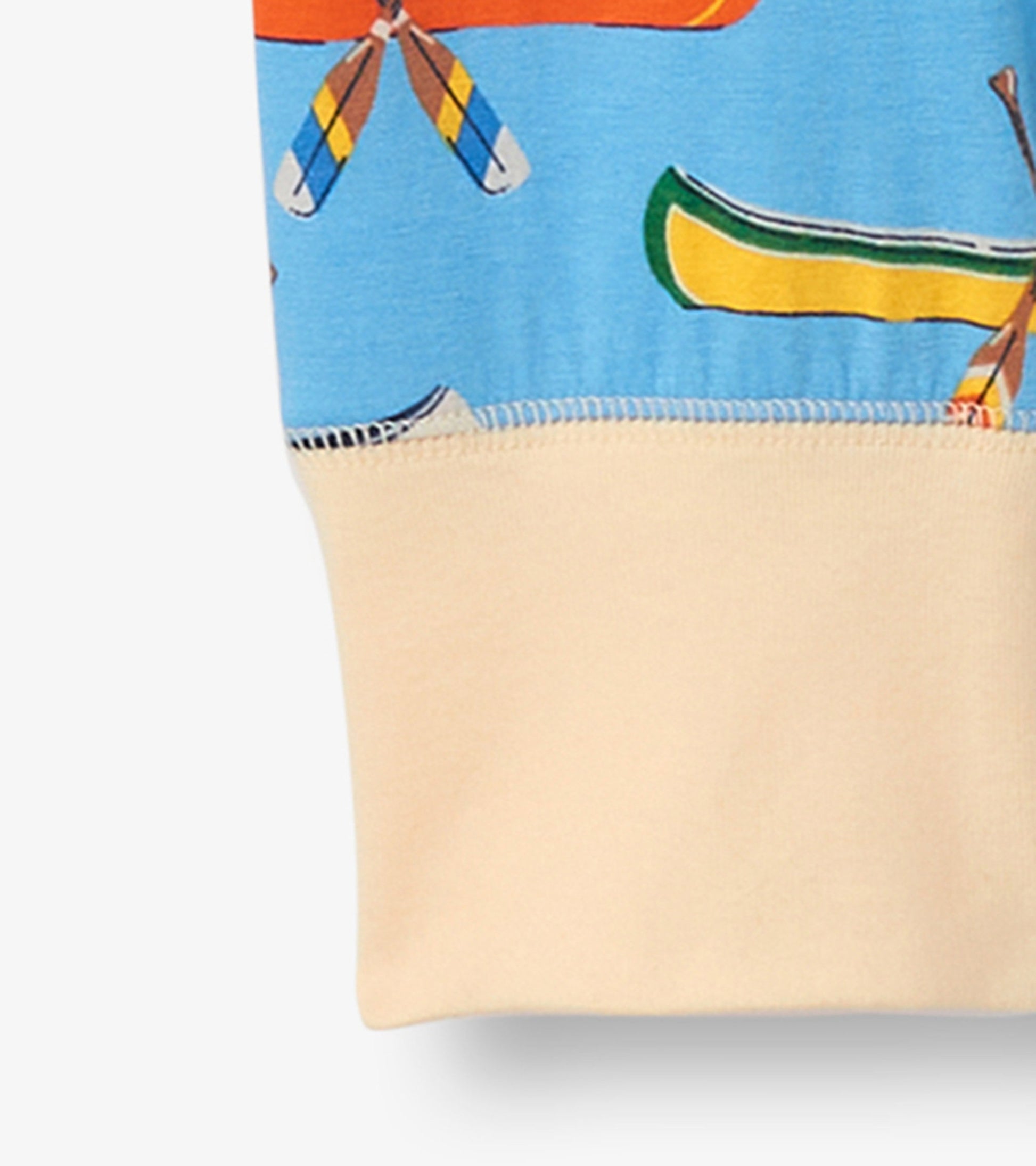 Light blue sleep leggings featuring a canoe and paddle print, with a soft beige cuff at the bottom.