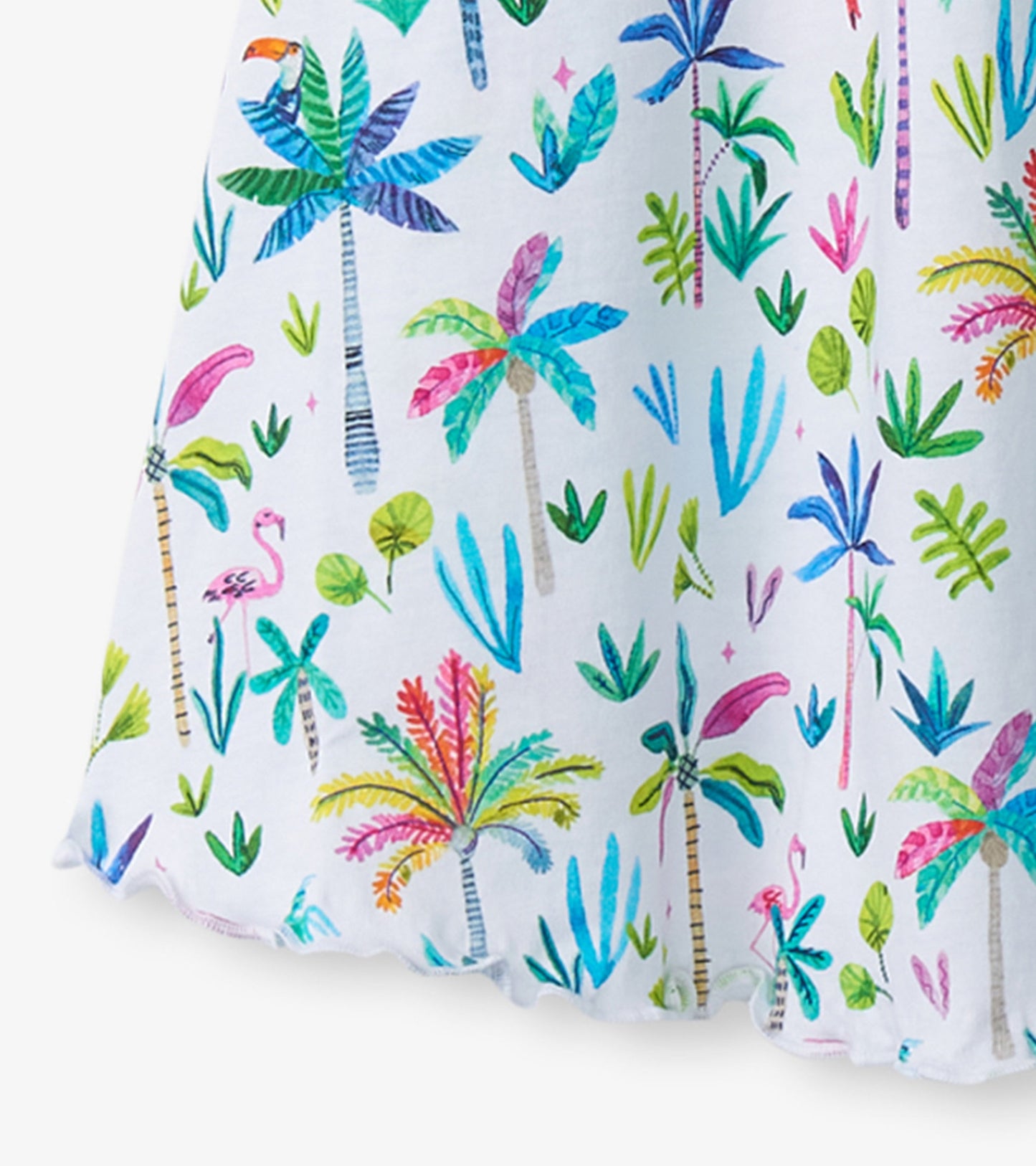 Colorful trapeze dress featuring a vibrant palm tree and tropical plant print on a white background.