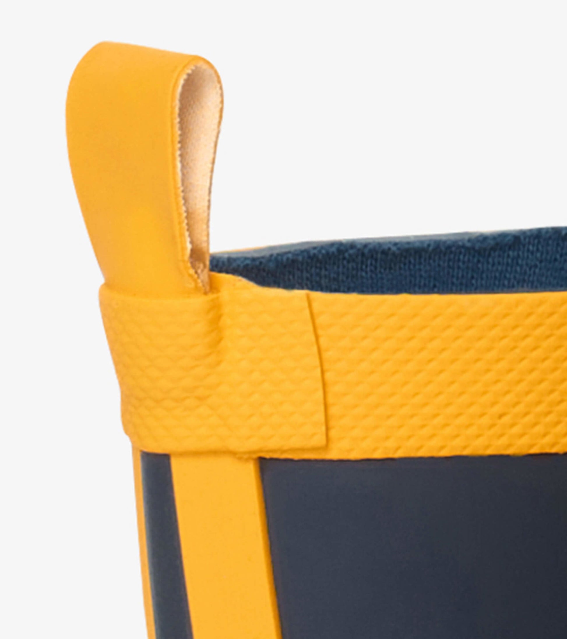 Navy and yellow matte rain boots with a textured finish and a pull tab for easy wear.