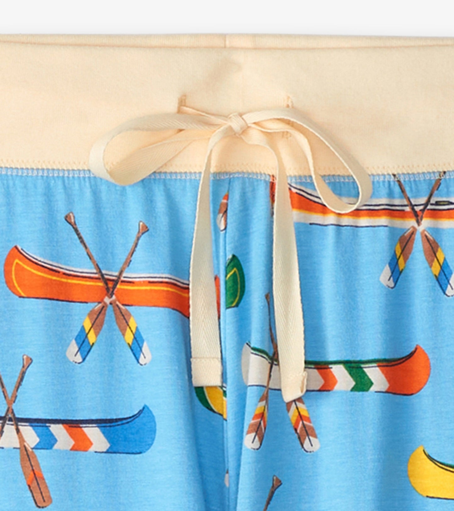 Light blue sleep leggings featuring a colorful canoe and paddle print, with a cream-colored waistband and drawstring.