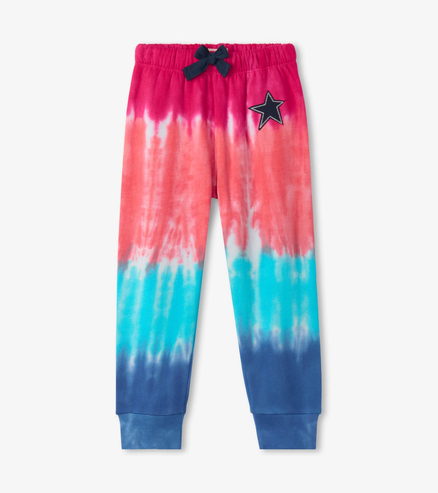 Colorful tie-dye joggers featuring pink, blue, and purple hues with a star patch and elastic waistband.