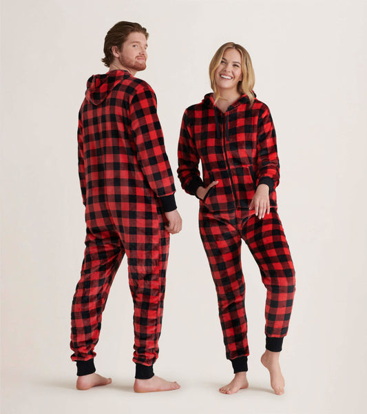 Red and black buffalo plaid hooded fleece jumpsuit with pockets, featuring a relaxed fit and ribbed cuffs.