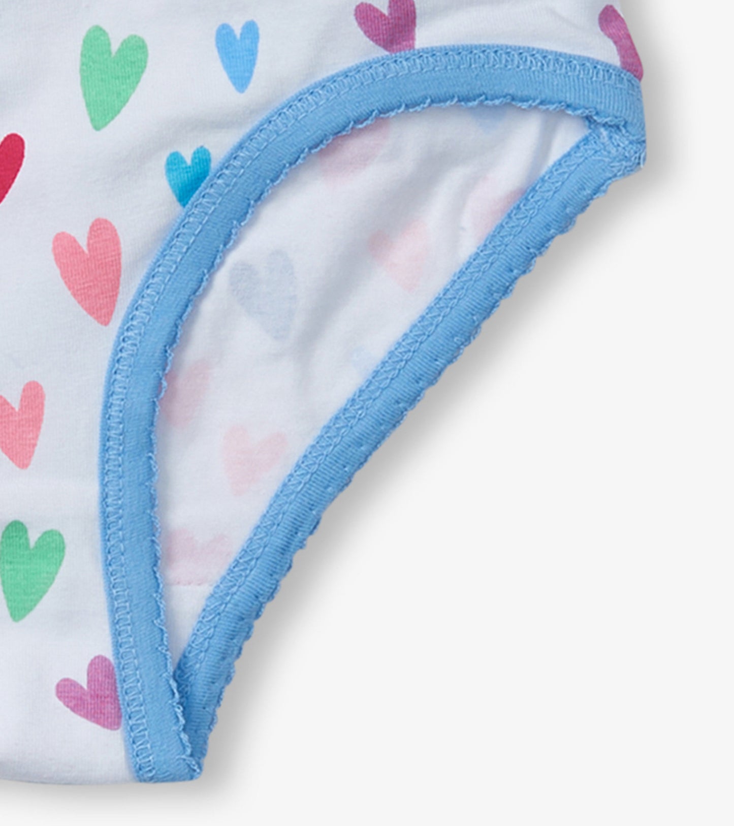 White brief underwear featuring colorful heart patterns and a light blue trim.