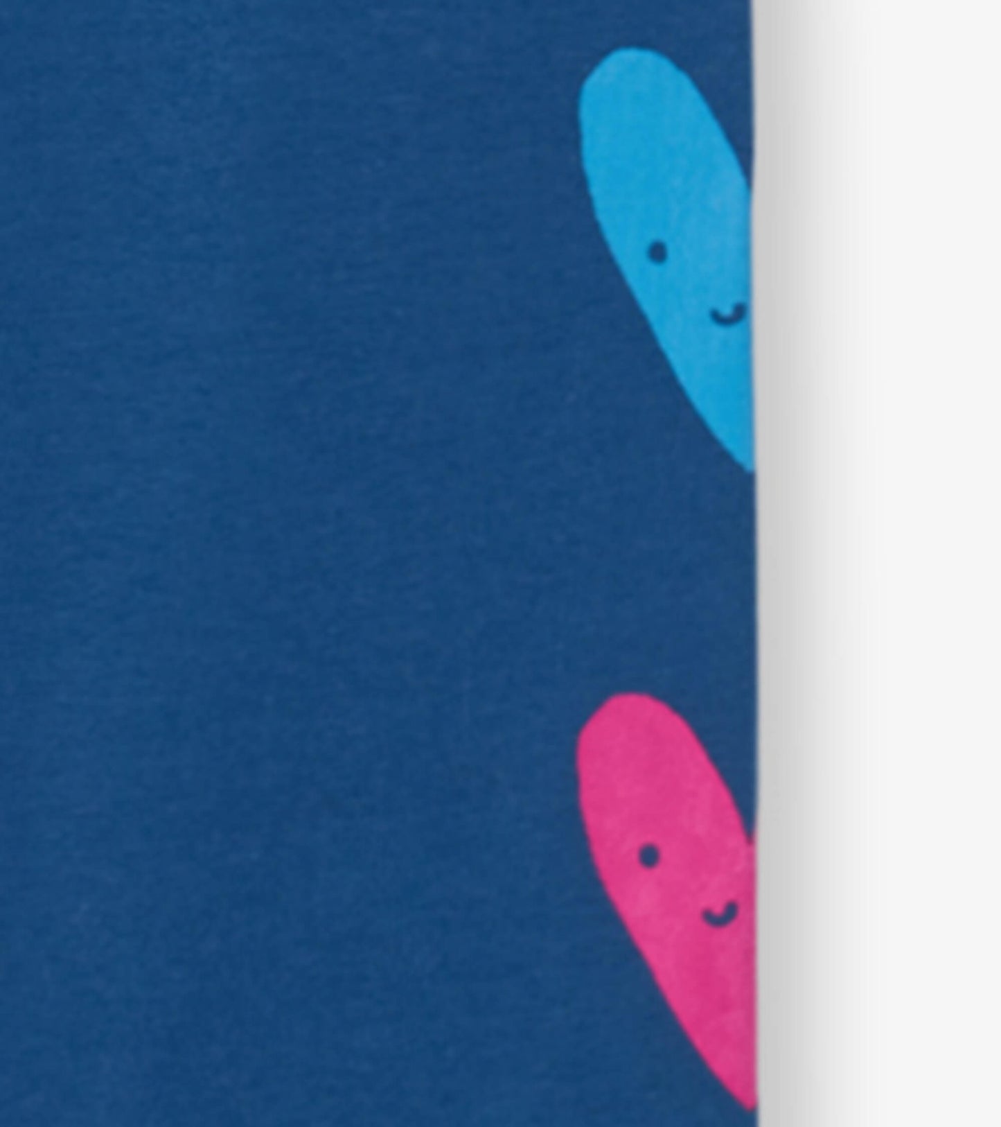 Navy leggings featuring colorful heart patterns in pink and blue, made from soft, stretchy material for comfort.