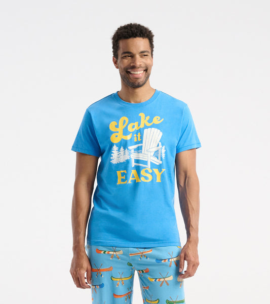 Light blue short-sleeve tee featuring a graphic with "Lake it Easy" and a chair design, perfect for casual wear.
