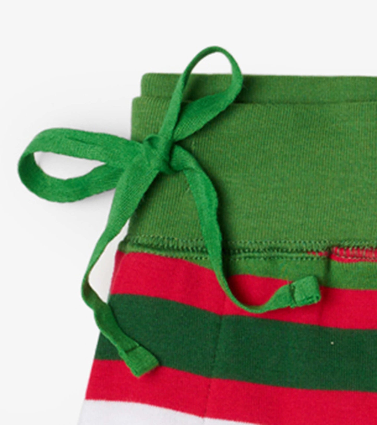Green waistband with a tie and red and white candy cane stripes on the pajama pants.