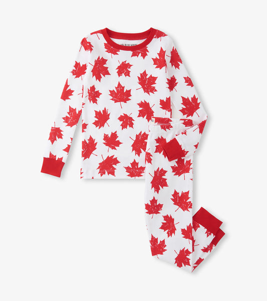 Red and white pajama set featuring a maple leaf pattern, with long sleeves and elastic waistband pants.