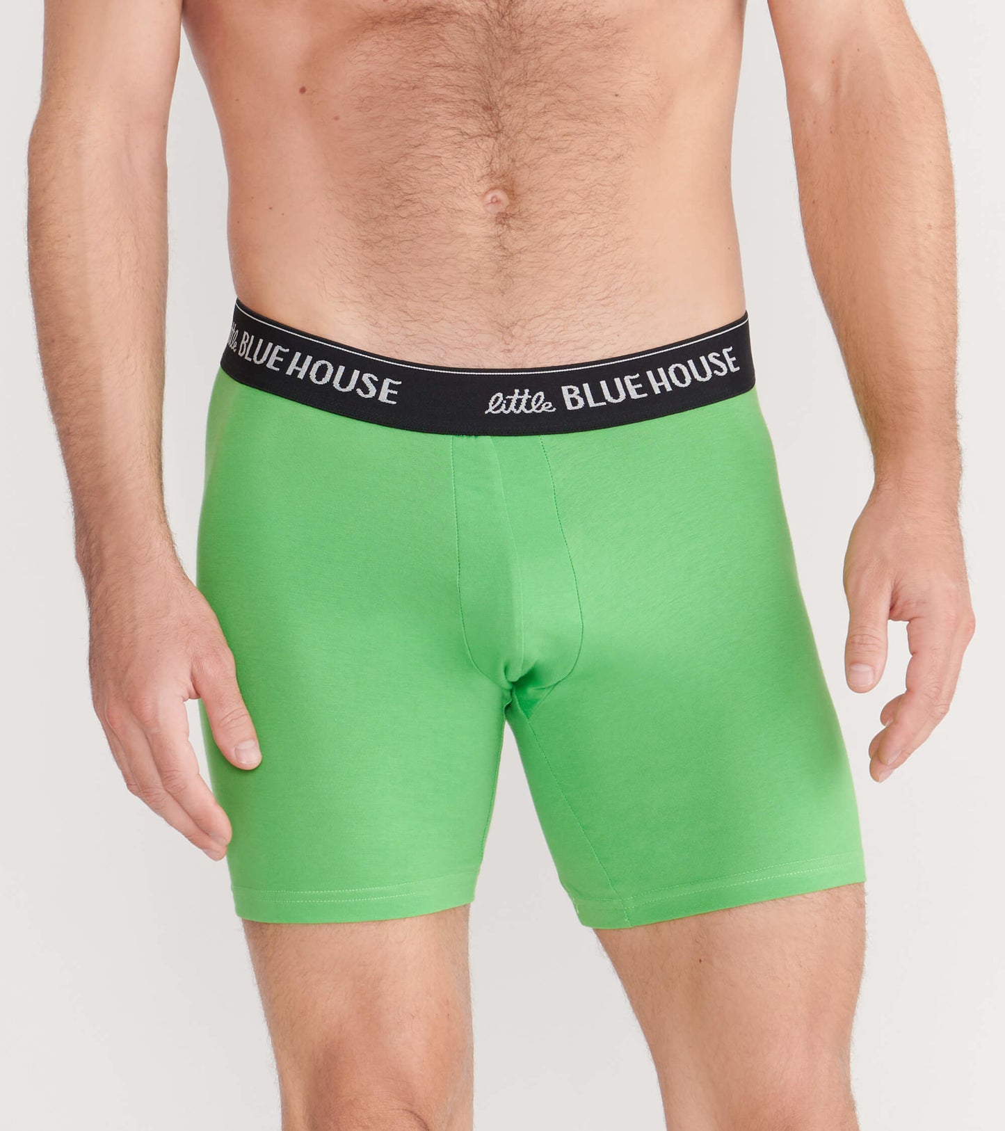 Green men's boxer briefs with a black waistband, featuring a snug fit and smooth fabric.
