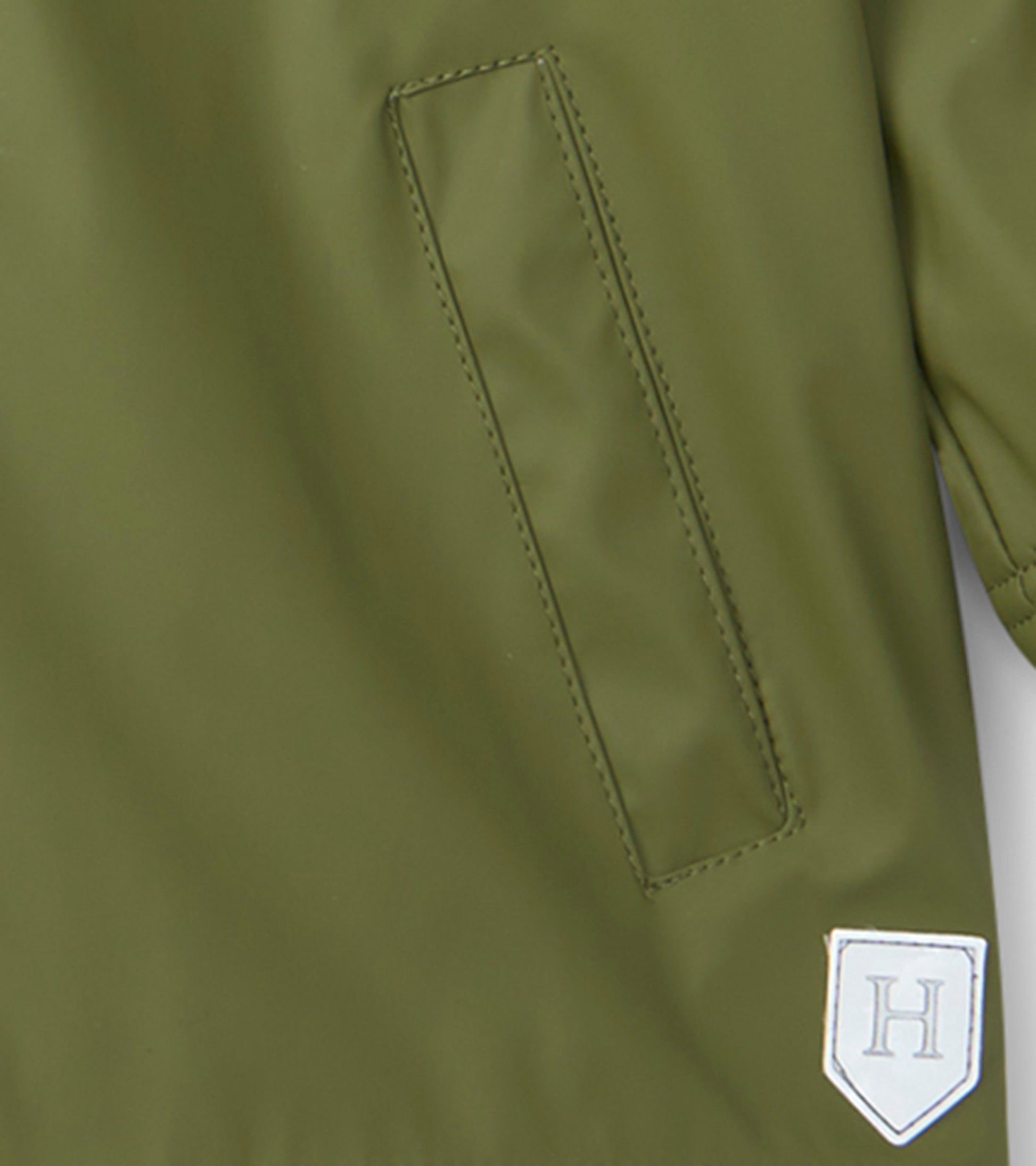 Forest green zip-up rain jacket with a smooth finish and a side pocket, suitable for boys.