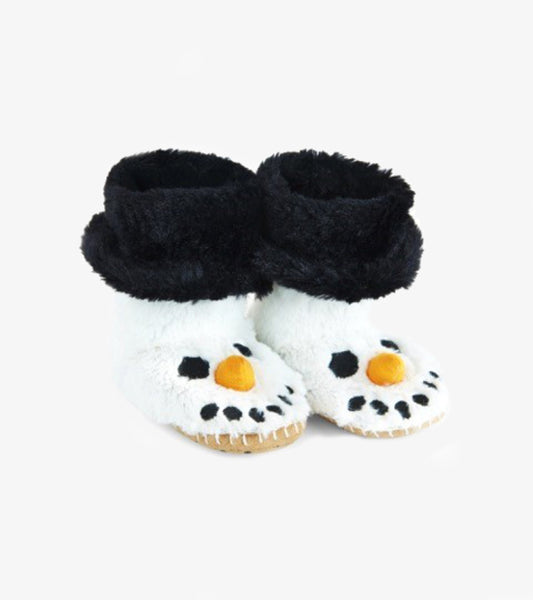 Fuzzy white snowman slippers with black cuffs, orange carrot nose, and black button eyes, perfect for kids.