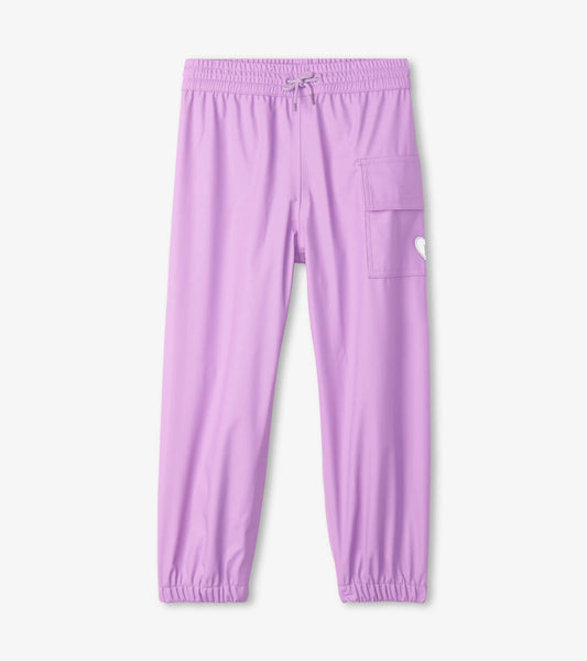 Lilac waterproof kids' rain pants with an elastic waistband and side pocket, designed for outdoor play.