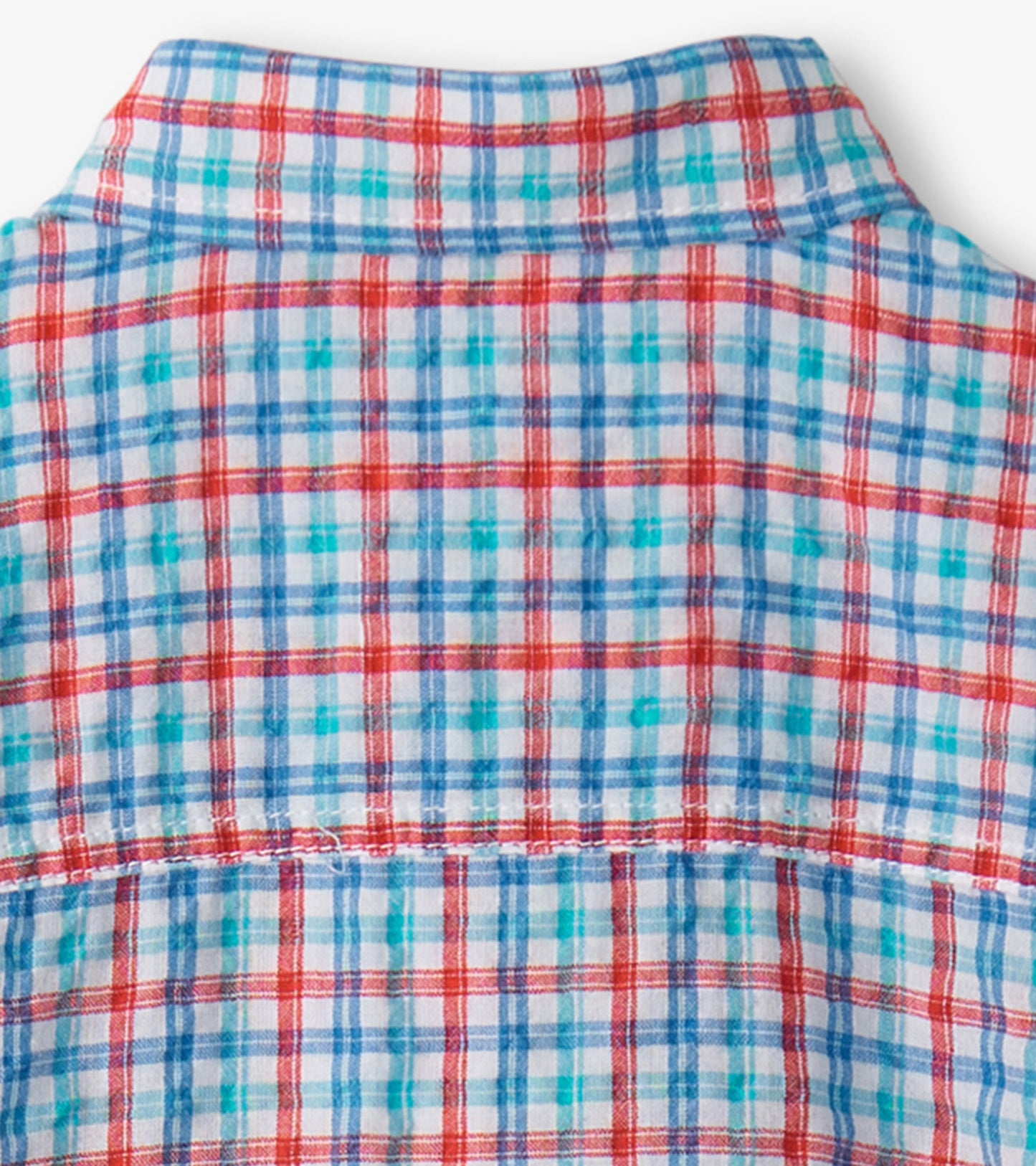 Button-down shirt featuring a colorful plaid pattern in red, blue, and turquoise on a light background.