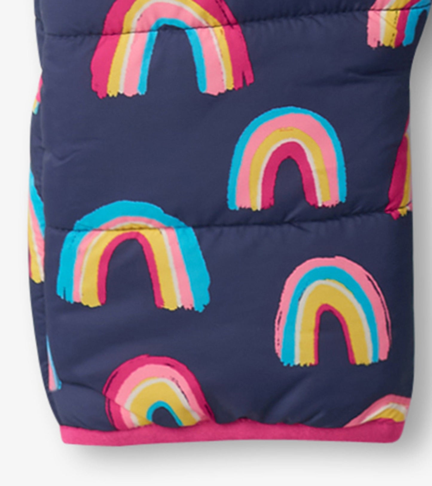 Navy baby snowsuit featuring colorful rainbow patterns, with a pink trim and quilted design for warmth.