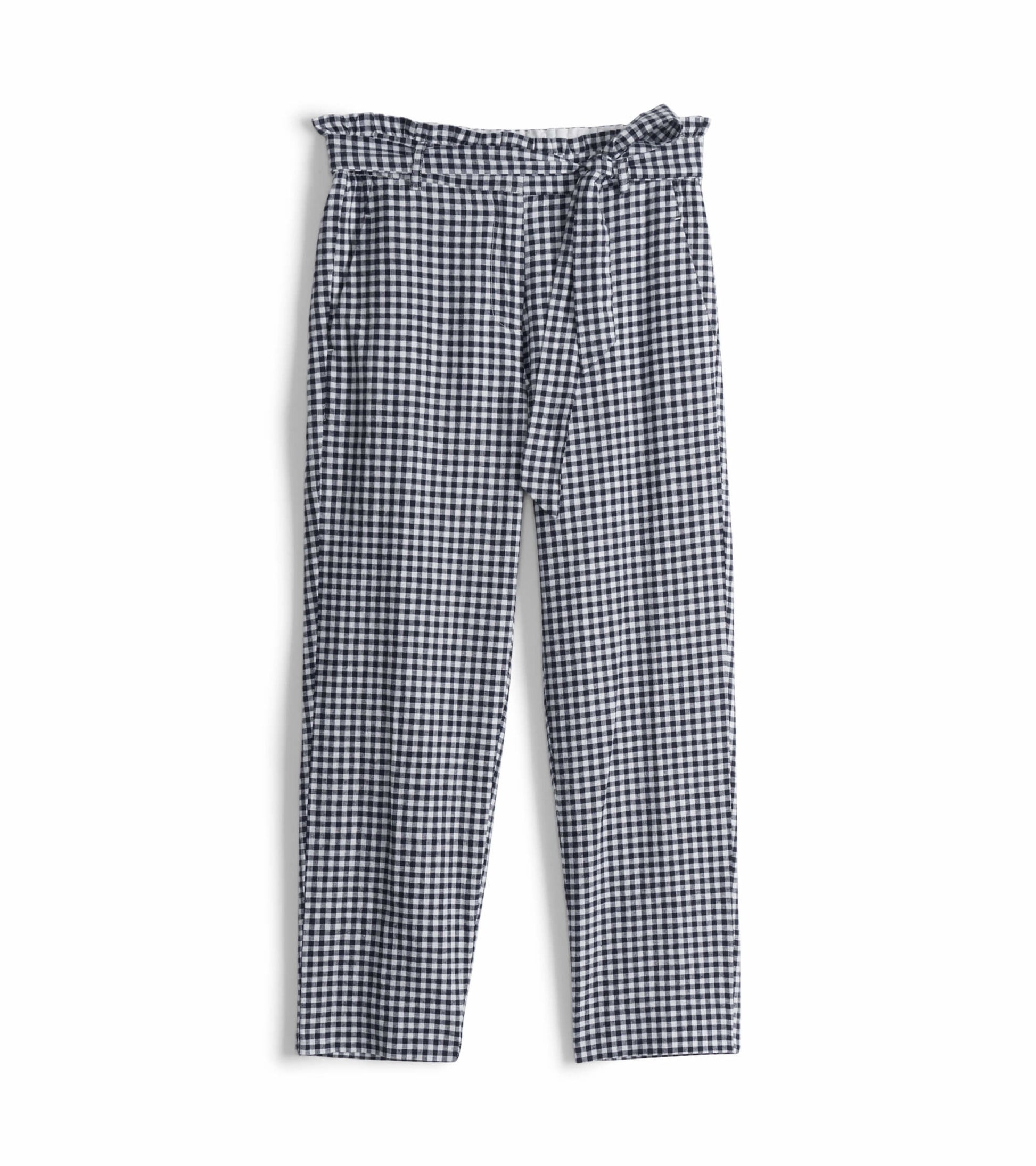Navy gingham paper bag pants with a ruffled waist and tie detail, featuring a relaxed fit and straight legs.
