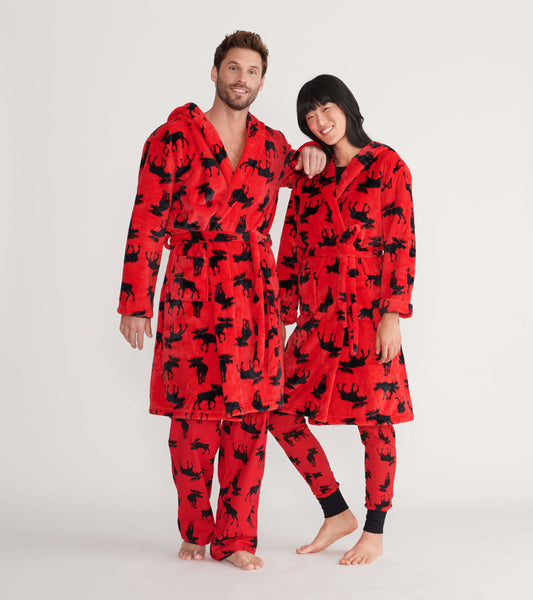 Red fleece robe featuring black moose silhouettes, worn by a man and woman, with matching pajama bottoms.