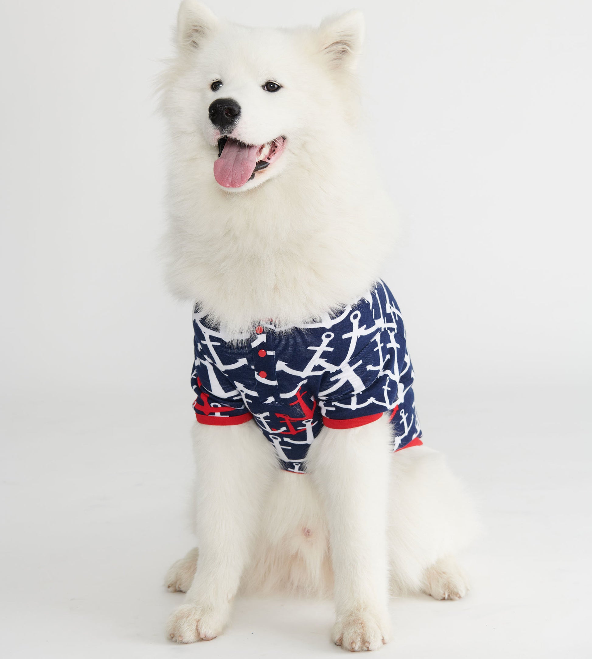 Navy dog tee featuring a white anchor pattern and red accents, designed for comfort and style.