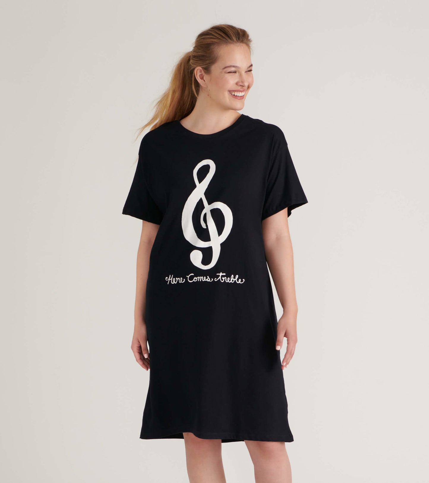 Black short-sleeve sleepshirt featuring a large white treble clef graphic and text design.