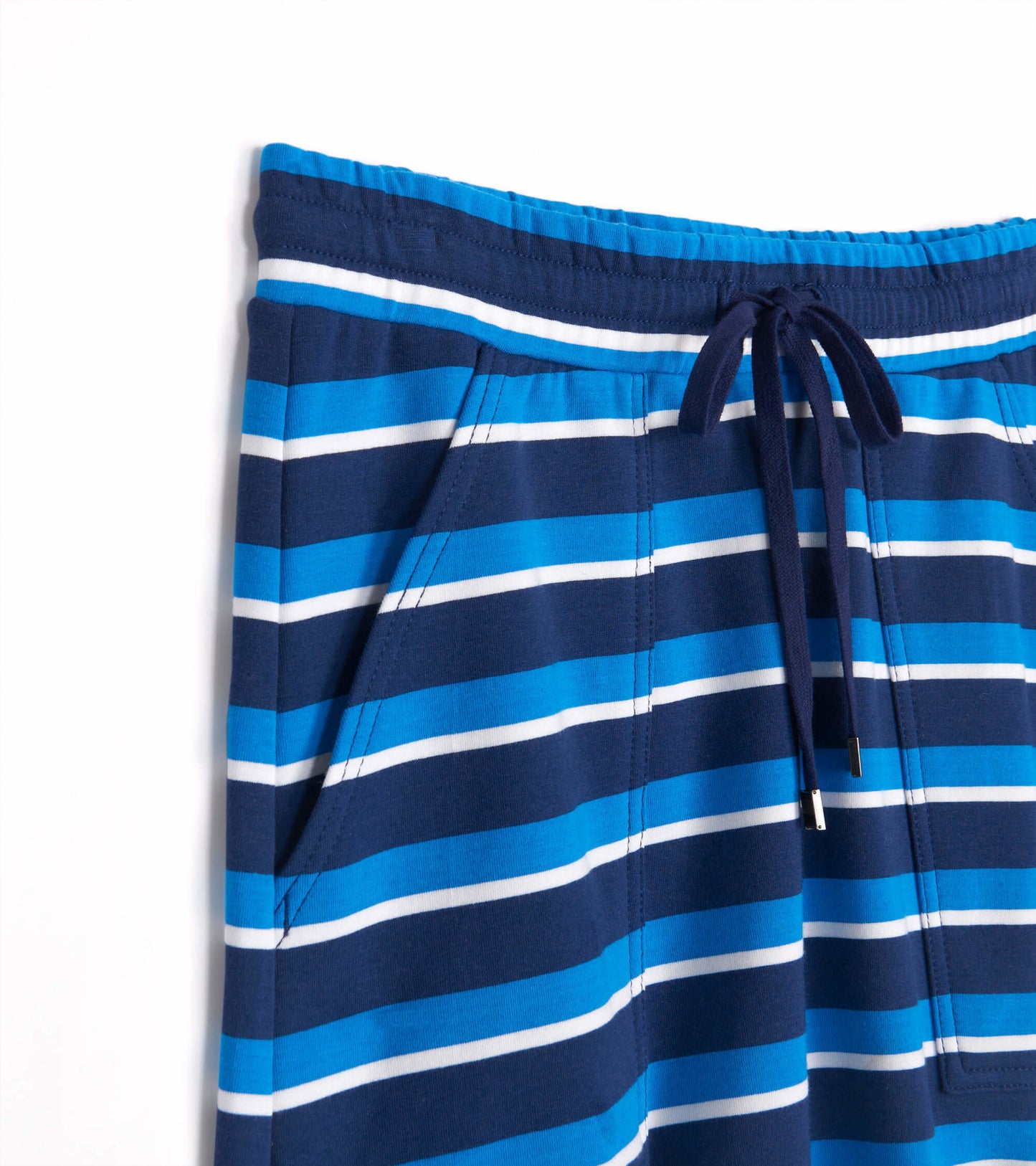Deep water striped skirt featuring shades of blue and white, with an elastic waistband and drawstring detail.