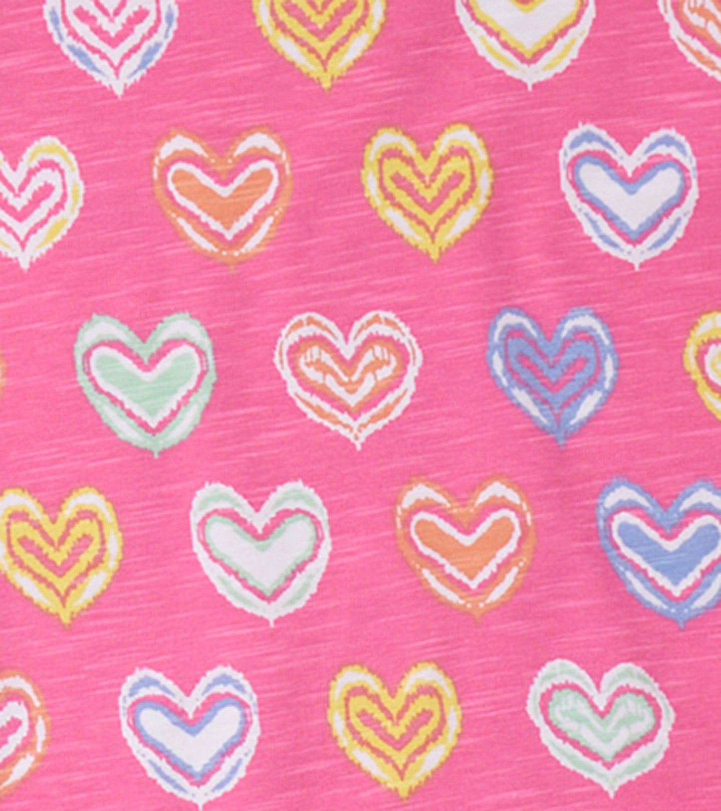Pink fabric featuring colorful shibori-style hearts in various shades, ideal for a girls' pajama set.