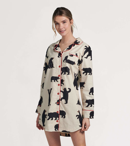 Cream flannel nightgown featuring black bear patterns and red piping, with a button-down front and long sleeves.