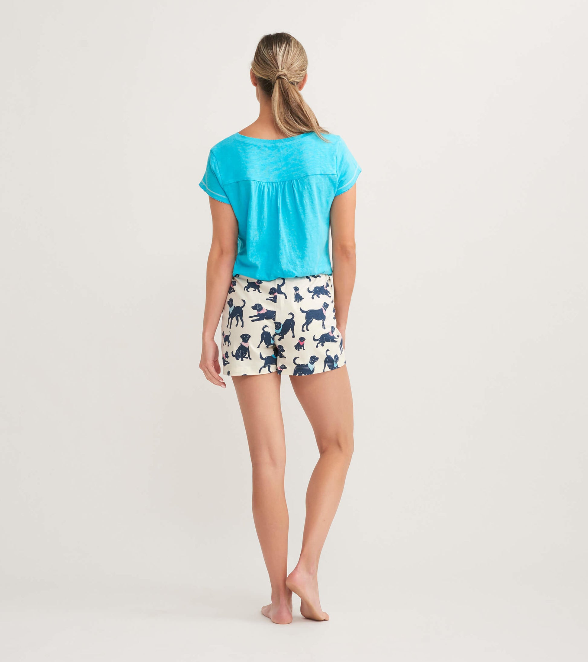 Cotton sleep shorts with a playful dog pattern, featuring a relaxed fit and an elastic waistband, shown from the back.
