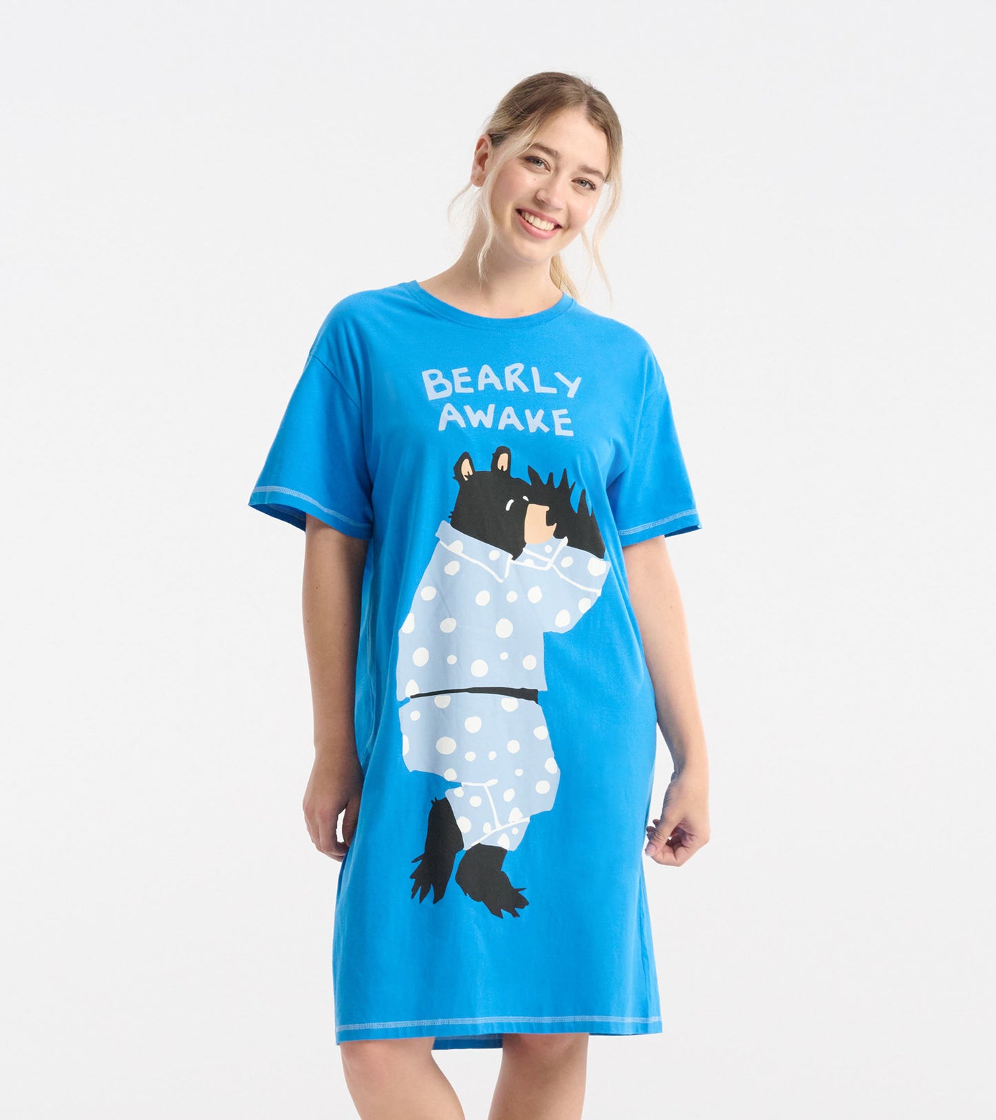 Blue sleepshirt featuring a bear graphic in pajamas with polka dots, short sleeves, and a relaxed fit.