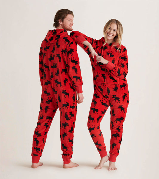 Red fleece jumpsuit featuring black moose patterns, with a hood and ribbed cuffs, worn by a man and woman.