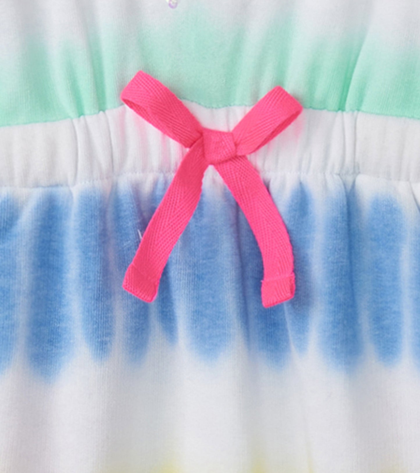 Colorful tie-dye dress featuring a pink bow at the waist, with a soft, lightweight fabric suitable for warm weather.