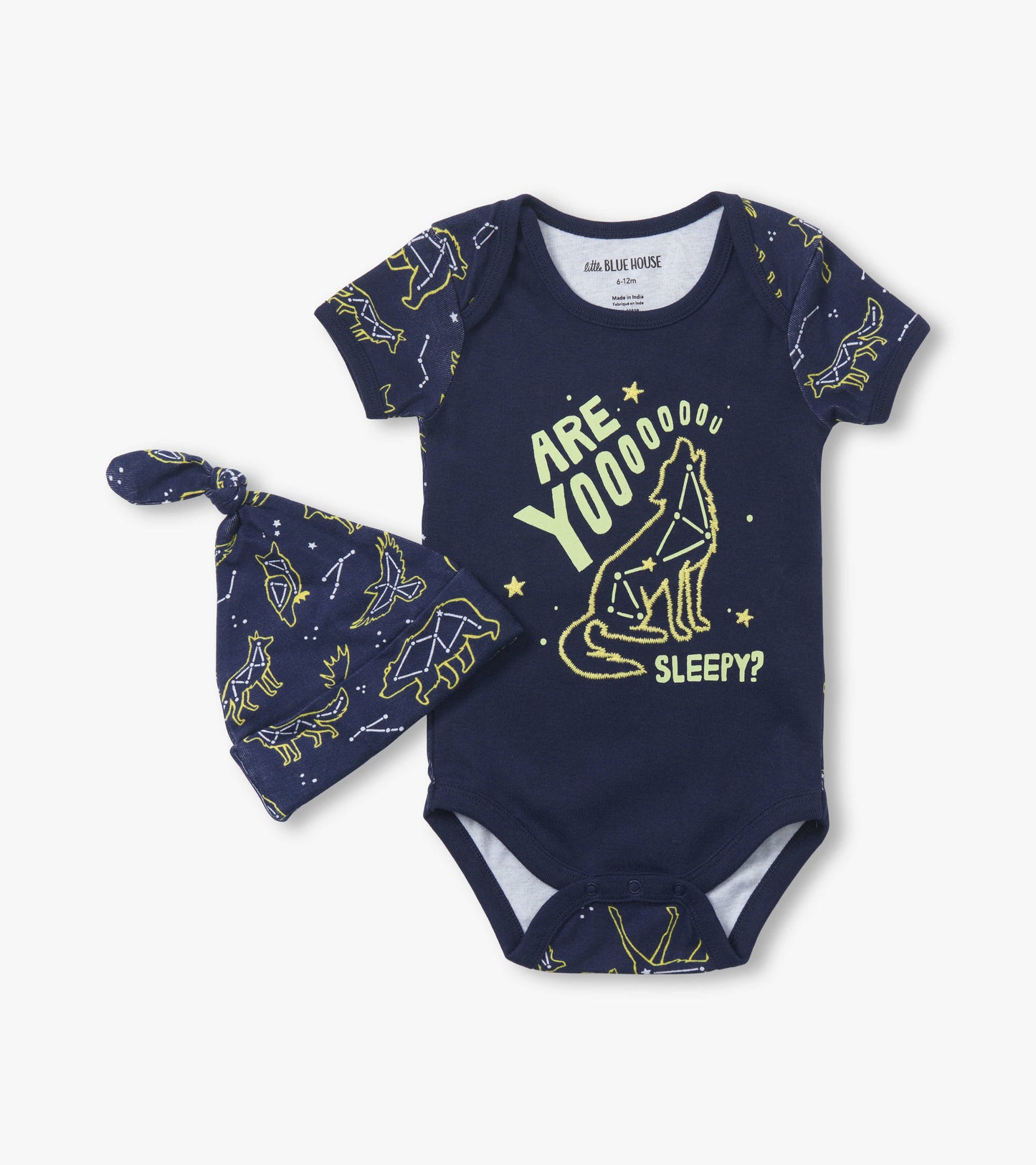 Navy blue baby bodysuit with short sleeves and matching hat, featuring a playful wolf and constellation print.