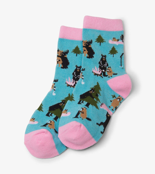 Light blue kids' crew socks featuring playful animal and nature patterns, with pink cuffs and toes. Suitable for ages 2-7.