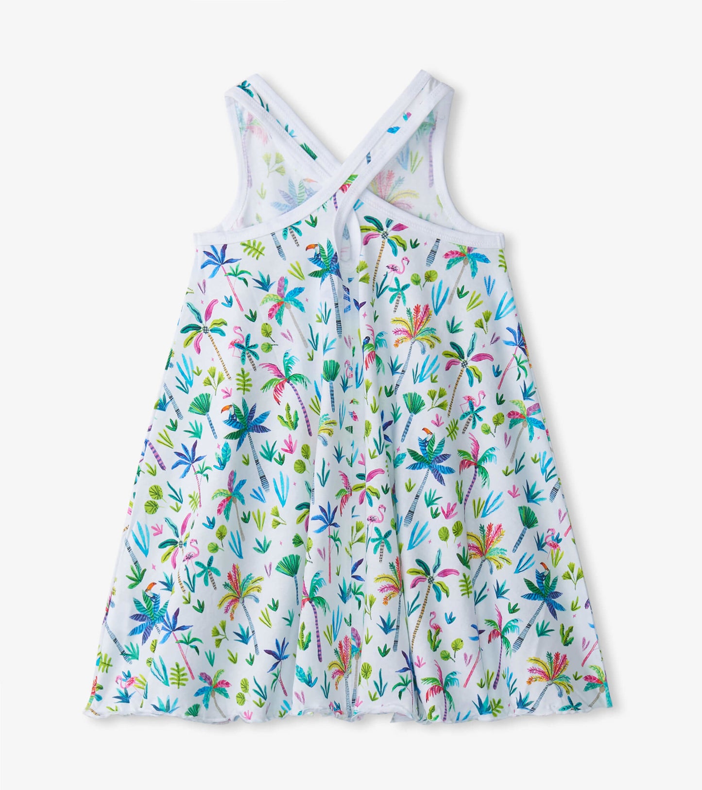 White trapeze dress featuring a colorful palm and floral print with crisscross straps at the back.