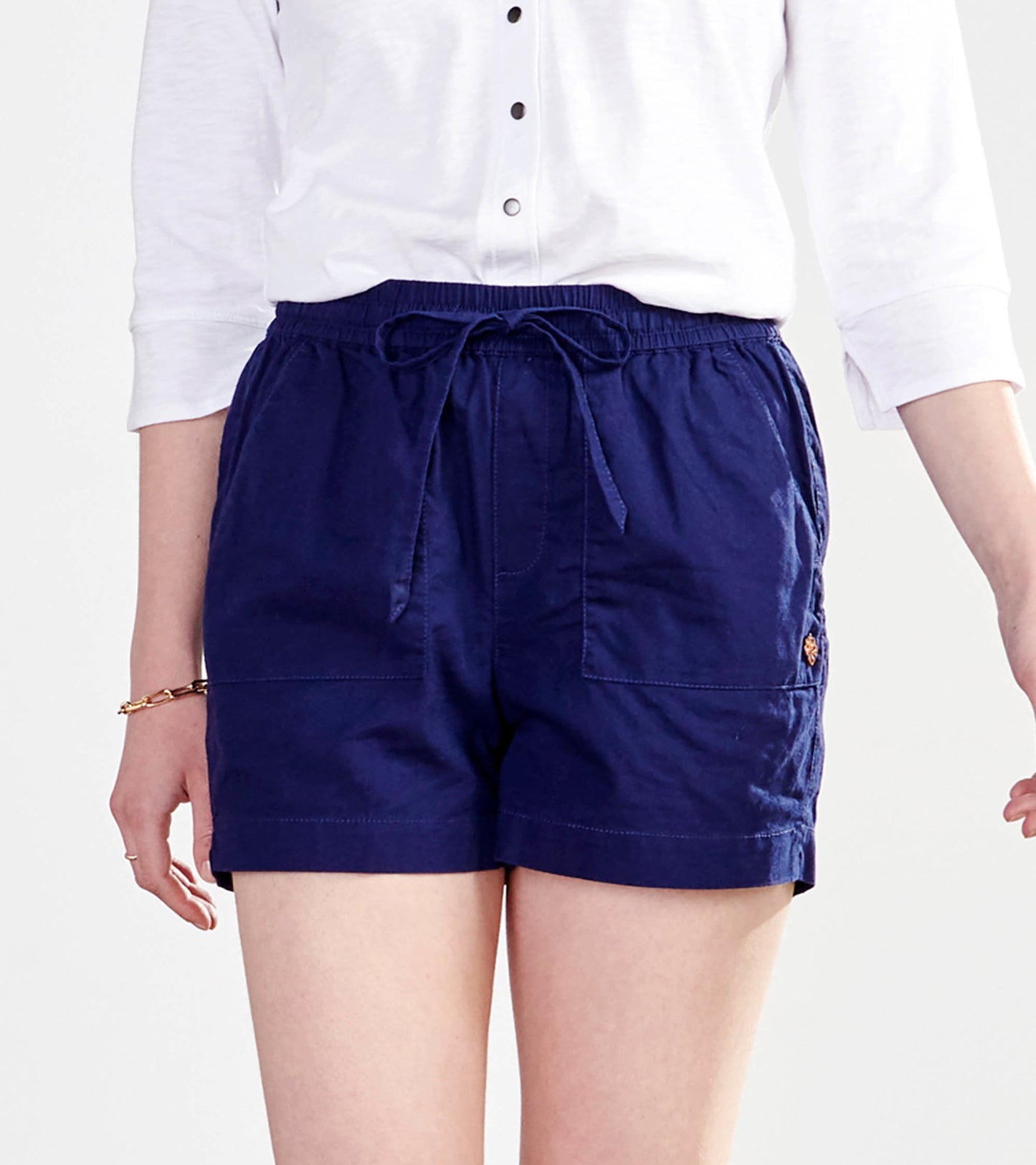 Patriot blue shorts with a drawstring waist and two front pockets, styled for casual wear.