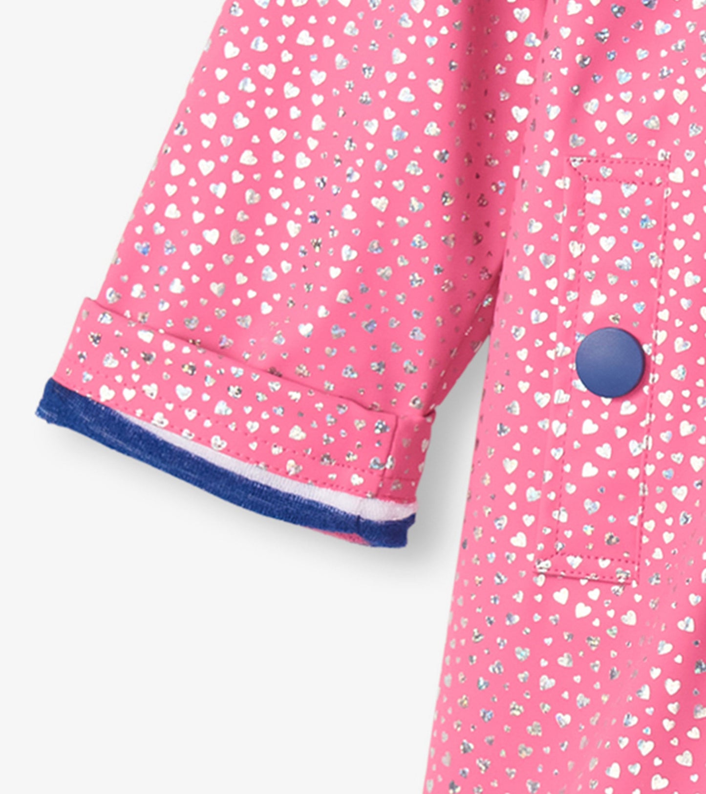 Pink button-up rain jacket featuring glitter hearts pattern and a blue button, with a rolled cuff detail.