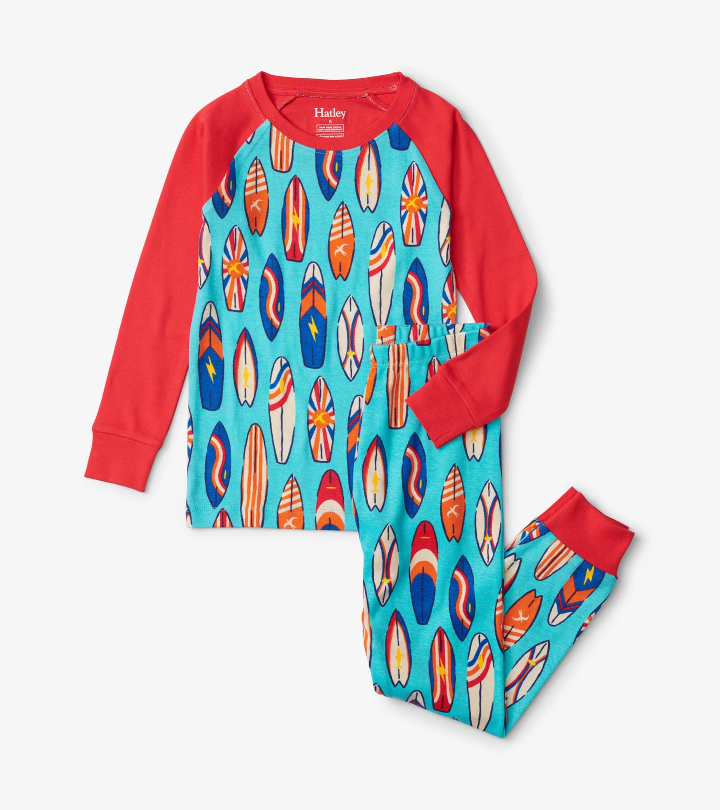 Red raglan long-sleeve top with colorful surfboard print and matching pajama pants, perfect for cozy sleepwear.