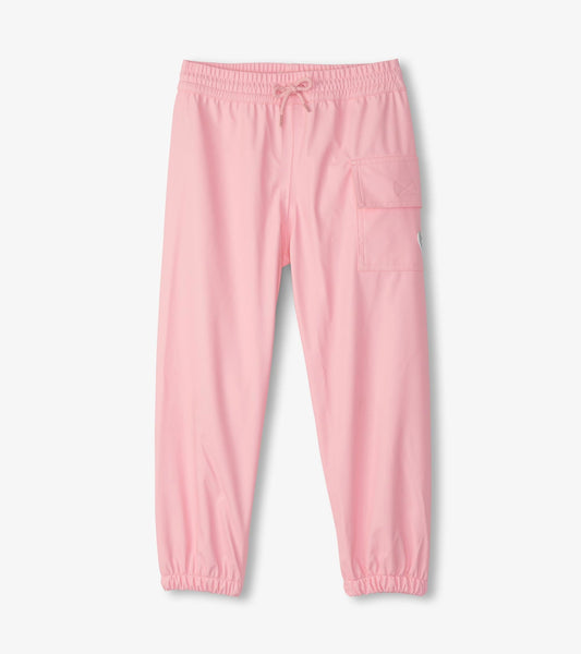 Light pink kids' rain pants with elastic waistband and side pocket, designed for outdoor play.
