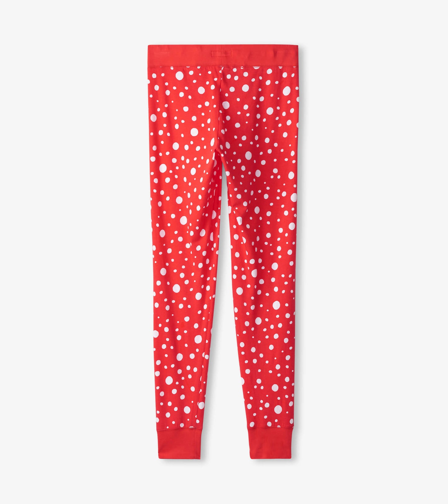 Red leggings featuring a playful white polka dot pattern, designed for comfortable holiday sleepwear.