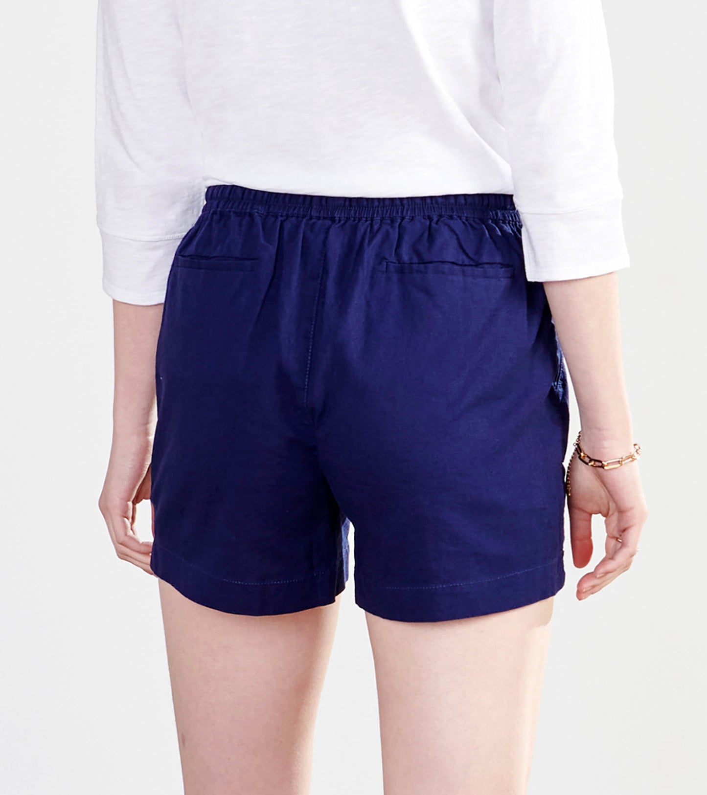 Patriot blue shorts with an elastic waistband and back pockets, shown from the back.