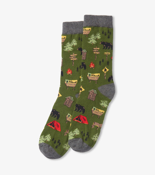 Green crew socks featuring camping-themed patterns, including bears, tents, and trees, with a gray cuff.