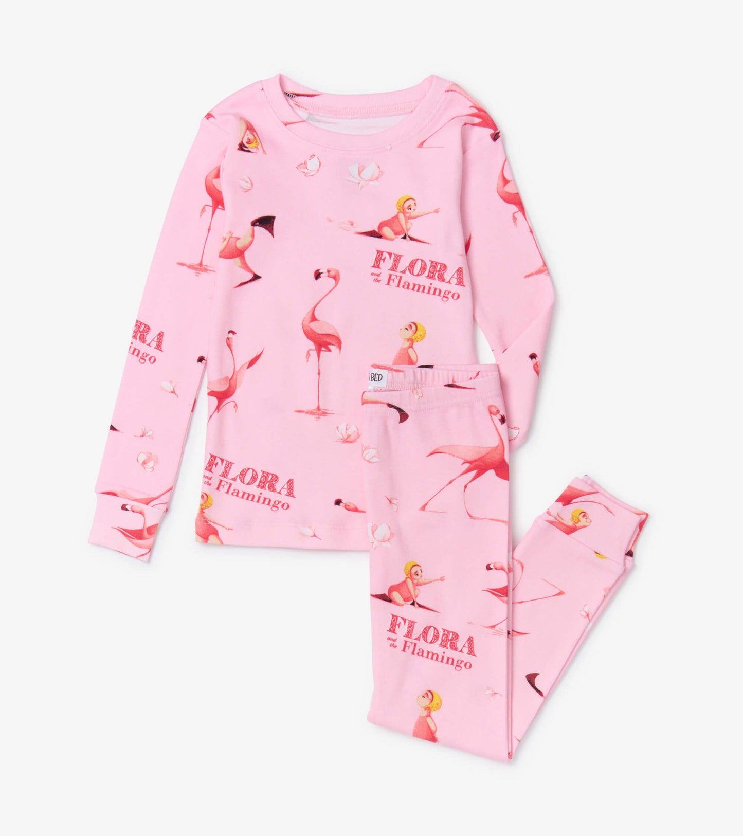 Pink pajama set featuring a playful flamingo and girl print, with long sleeves and matching pants.