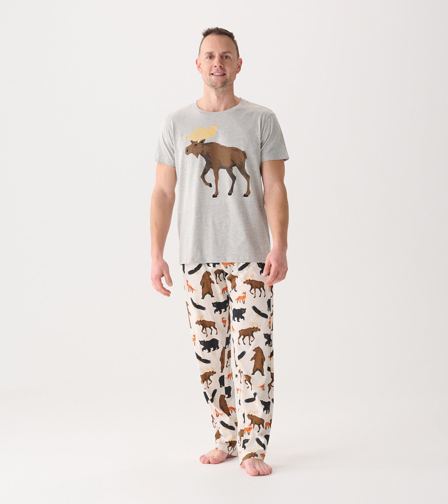 Men's cotton blend pajama pants featuring a wildlife pattern with various animals on a light background.