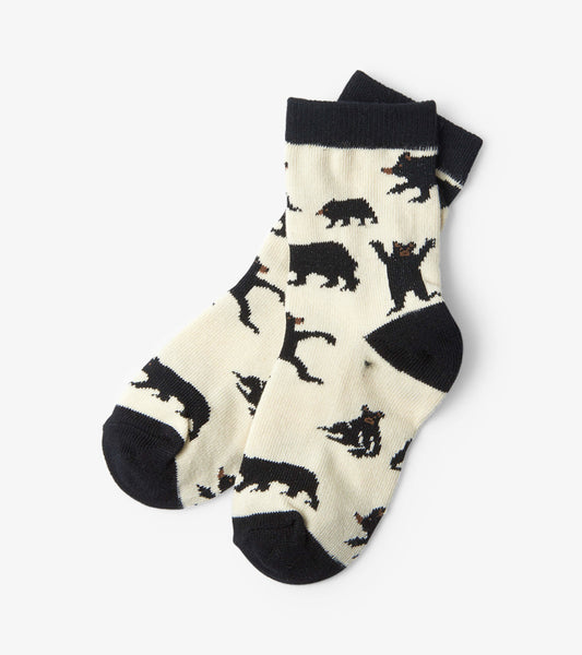 Cream socks featuring playful black bear patterns, with a dark navy cuff and toe. Suitable for kids ages 2-7.