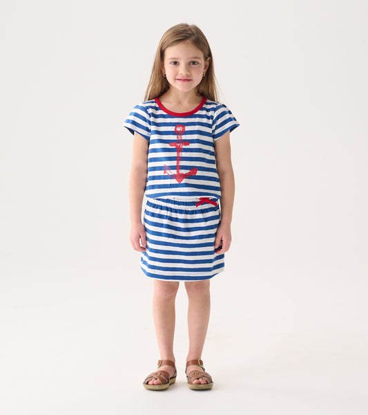Blue and white striped t-shirt dress with red anchor graphic and waistband, suitable for casual wear.