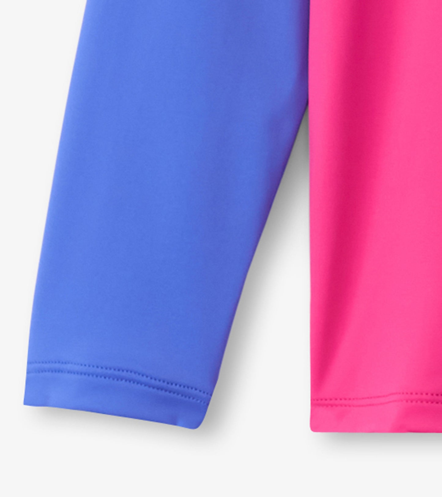 Fuschia purple long sleeve rashguard with contrasting blue sleeves, made from stretchy, quick-drying material.