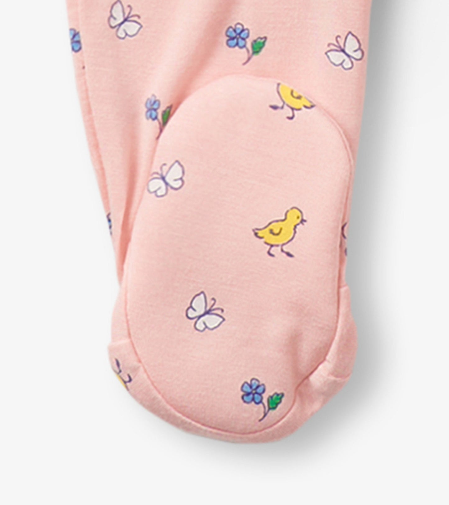 Pink footed sleeper with ruffles, featuring yellow chicks and butterflies in a floral pattern. Suitable for baby girls.