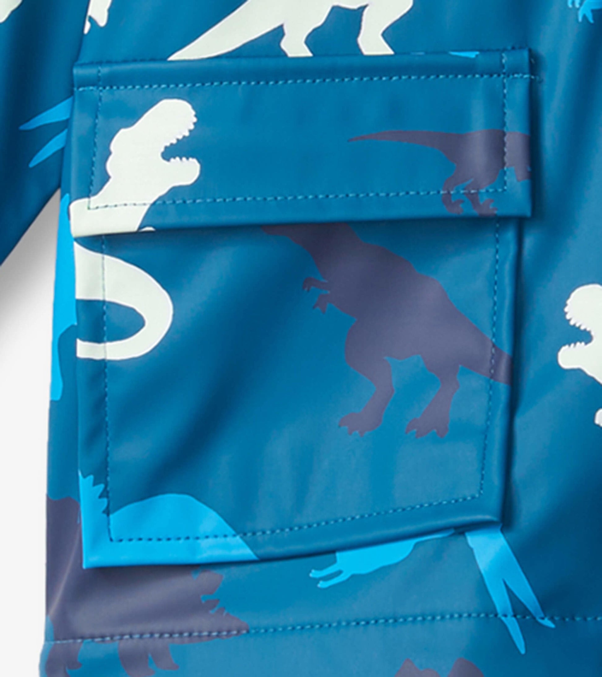 Blue waterproof raincoat featuring colorful dinosaur patterns and a front pocket, suitable for babies aged 9-24 months.