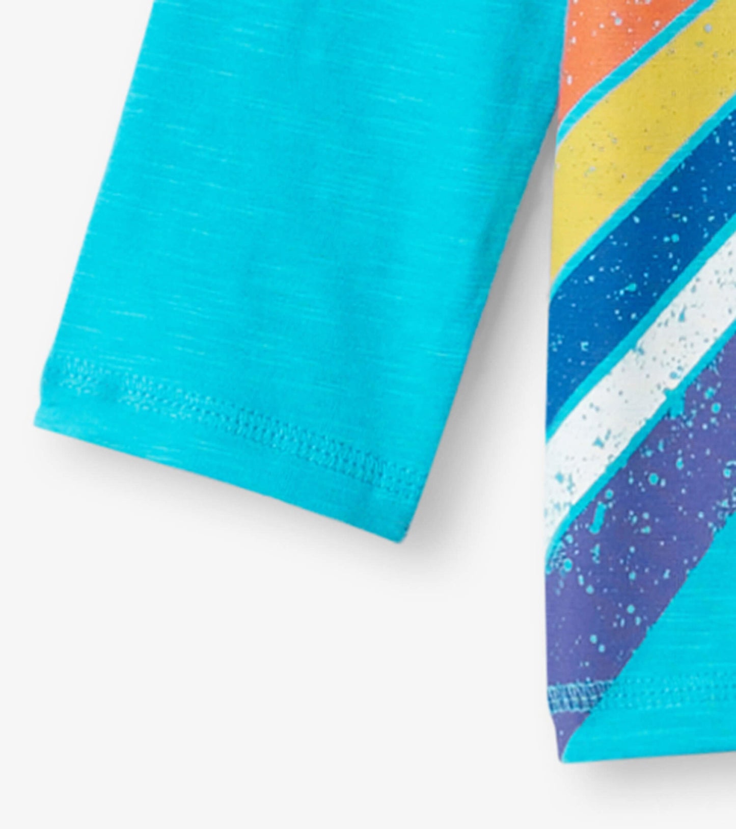 Turquoise long sleeve t-shirt featuring colorful rocketship graphics and stripes on the front.