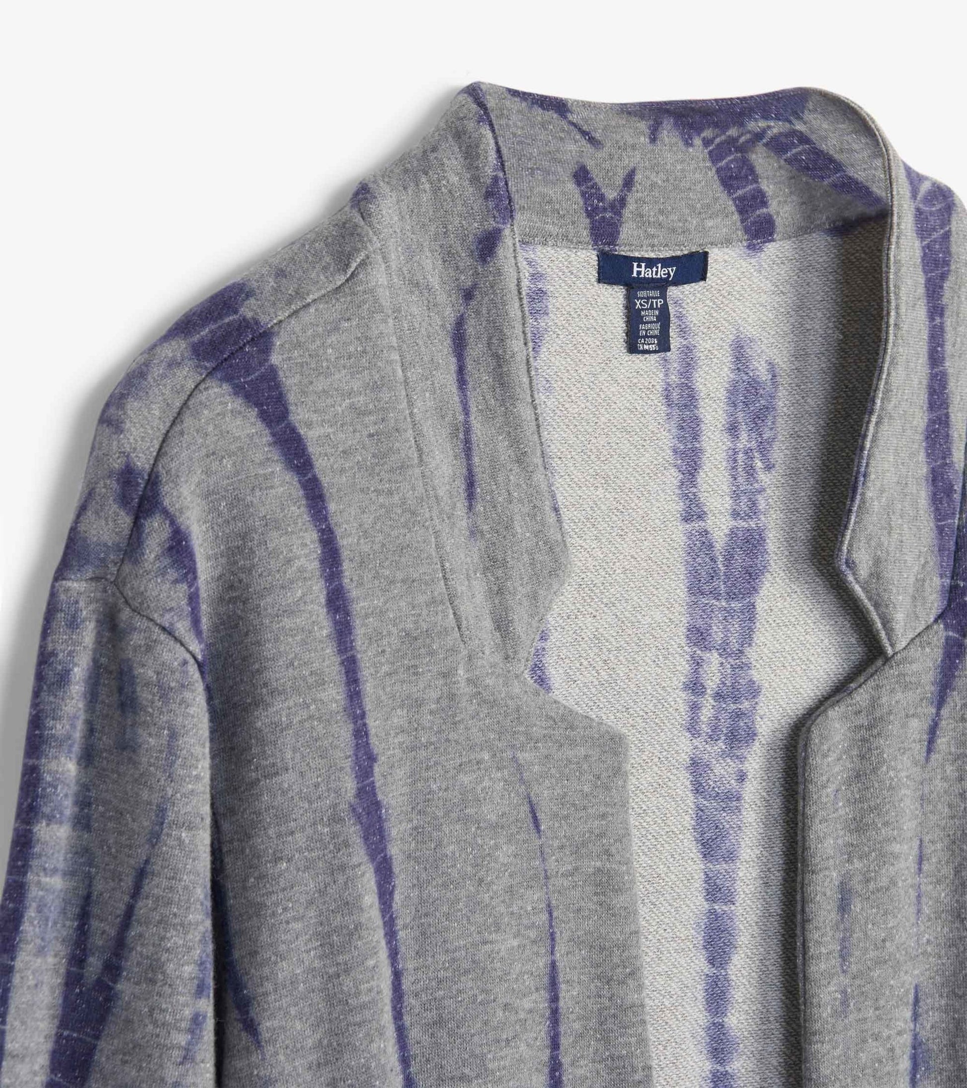 Gray cardigan featuring a storm tie-dye pattern in purple hues, with an open front and a relaxed fit.